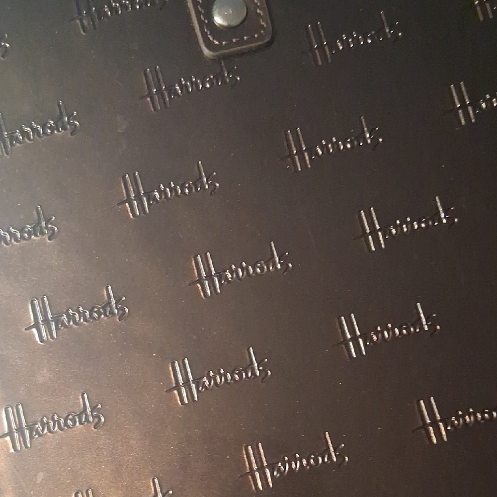 Glossy Black Tote Bag with Subtle Logo Pattern - Picture 2 of 3